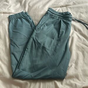 Ice blue north face joggers with front pockets and one back pocket zip up pocket